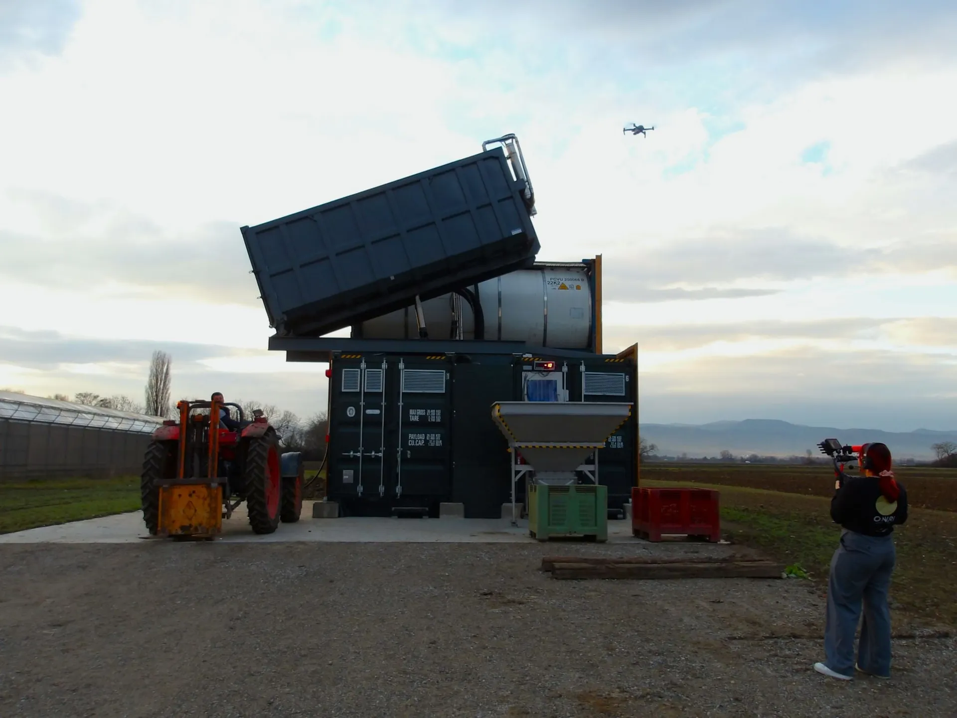 The BioCapsule unit being installed on site, with a drone recording overhead